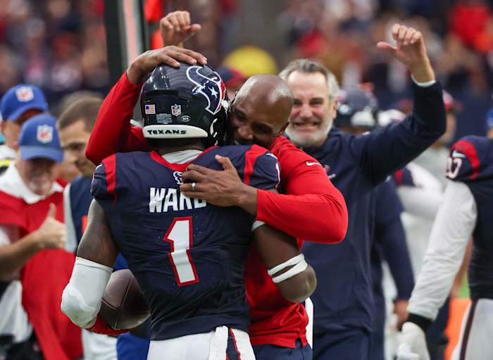 Texans head coach DeMeco Ryans hugs safety Jimmie Ward (1) after he intercepted the ball against the Denver Broncos late in the fourth quarter at NRG Stadium.